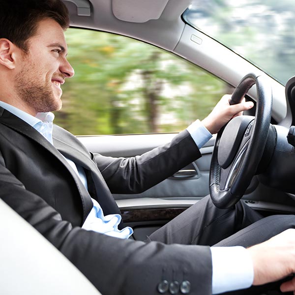 Happy man driving a car